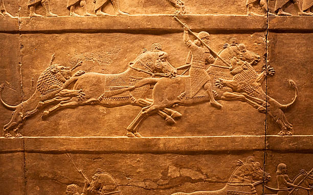 Lions hunting in ancient Assyria stock photo