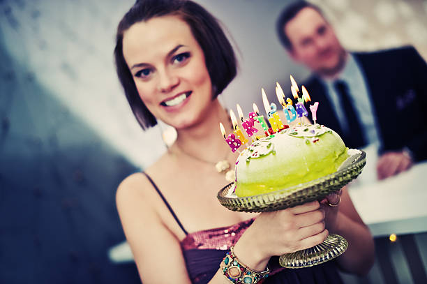 istock Woman showing a birthday cake 183380287
