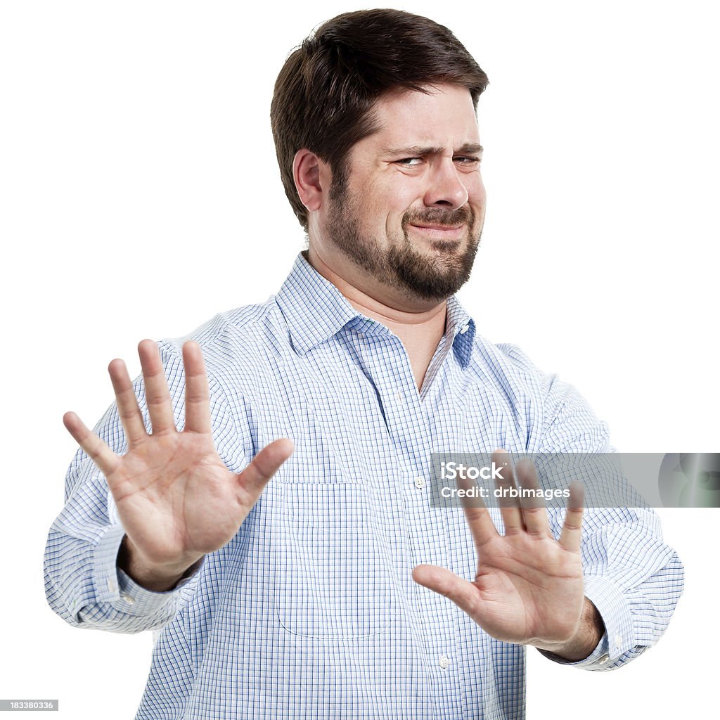 Irritated Man With Hands Out In Stop Gesture Portrait of a man on a white background. Disgust Stock Photo