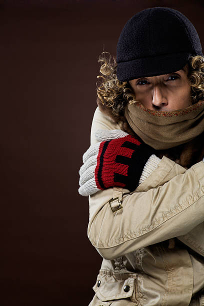istock Windy and cold, man suffering from bad weather with cap. 183380422