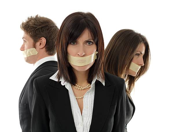 istock business team with mouth closed 183380491