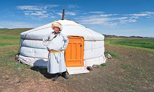istock Mongolian man in national clothing, yurt on the background 183380871