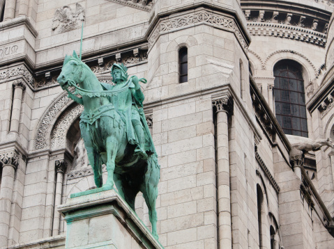 Detail of Basilica Sacré-Coeur in Paris. Statue of a knight.