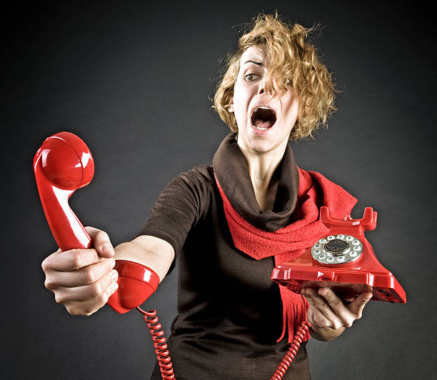 istock Young Woman shouting into telephone 183381232
