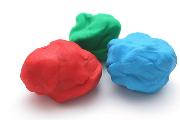 Blue, red and green moulds of plasticine n a white surface "Colorful child's play clay (Red, Green, Blue)." childs play clay stock pictures, royalty-free photos & images