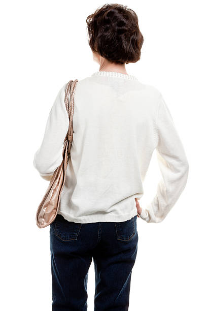 Rear View Of Mature Woman With Purse Portrait of a mature woman on a white background. back of head photos stock pictures, royalty-free photos & images