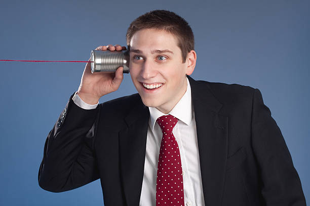 istock Business Man on Tin Can Phone 183381548