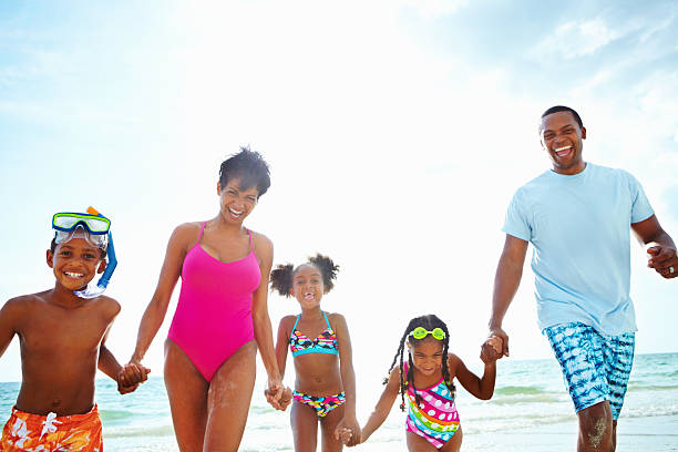 istock Happy family at the beach 183381598