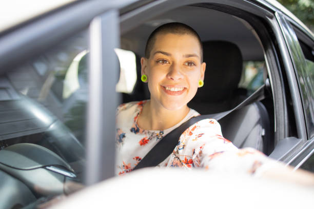 istock Young woman is driving a car 1833820635