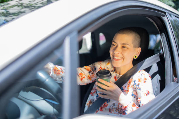 istock Young woman is driving a car 1833821109