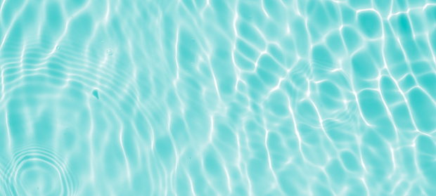 Abstract transparent water shadow surface texture natural ripple on blue background