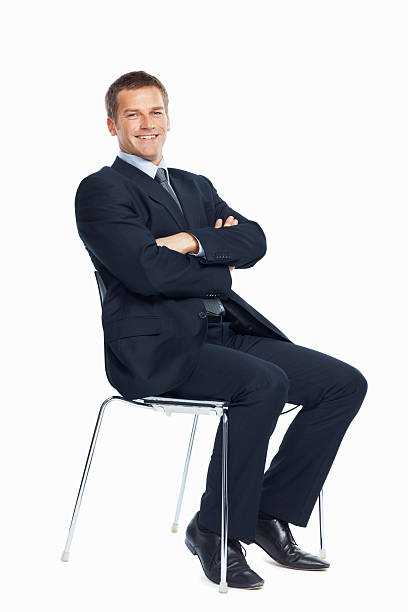 istock Smiling businessman sitting on a chair 183382981