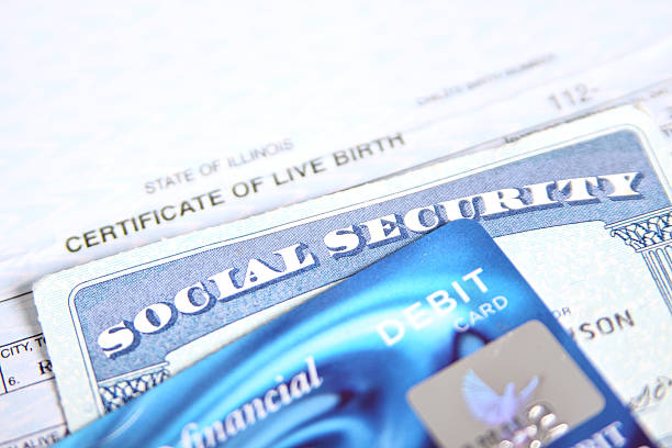 Important Documents "Social Security Card, Birth Certificate, and Debit Card. (Shallow depth of field. Focus on Social Security Card)." identity theft photos stock pictures, royalty-free photos & images
