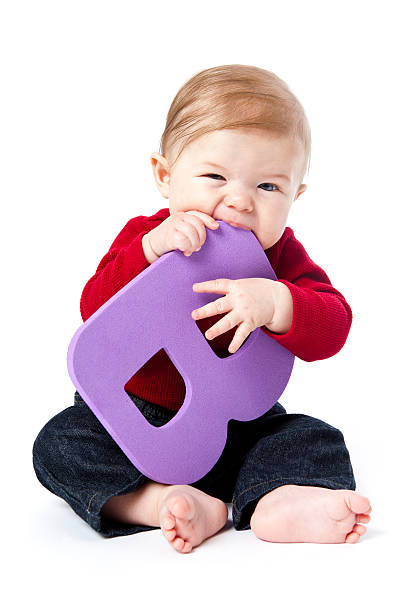 istock Baby Holding Letter B 183383137