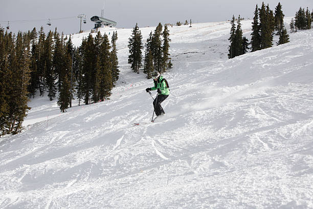 istock woman skier and ski lift 183383280