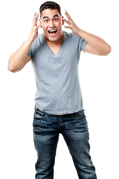 Excited Young Man Standing Portrait of a young male on a white background. crew cut stock pictures, royalty-free photos & images