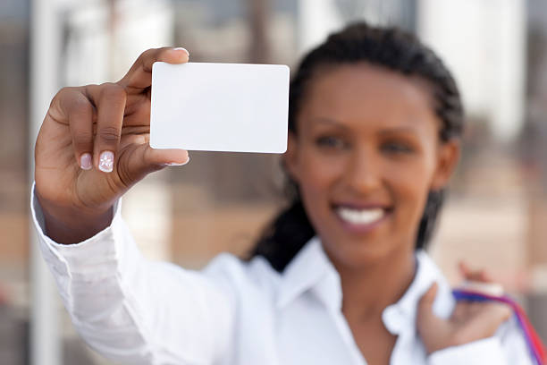 istock Woman showing purchasing card. 183383375