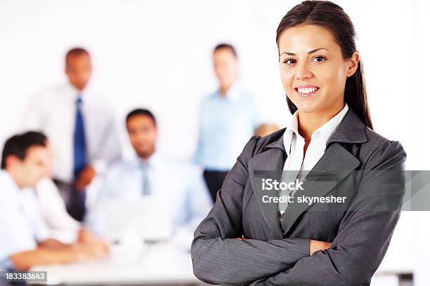 Businesswoman Is Standing On Foreground With A Crossed Hand Stock Photo - Download Image Now