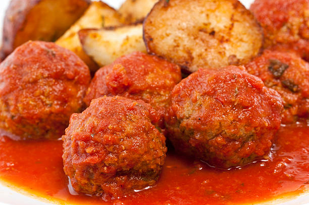 Homemade tomato marinated meatballs with roasted potatoes