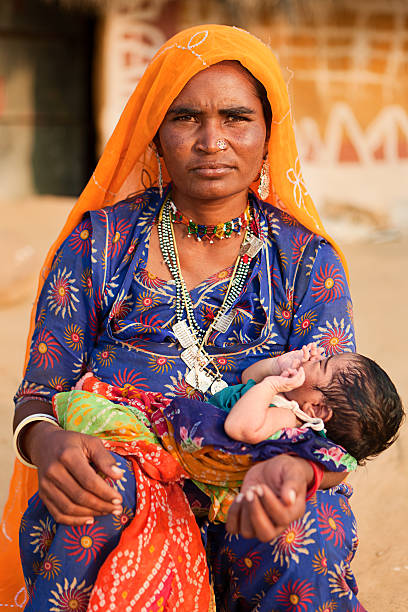 istock Indian woman holding her child 183384209