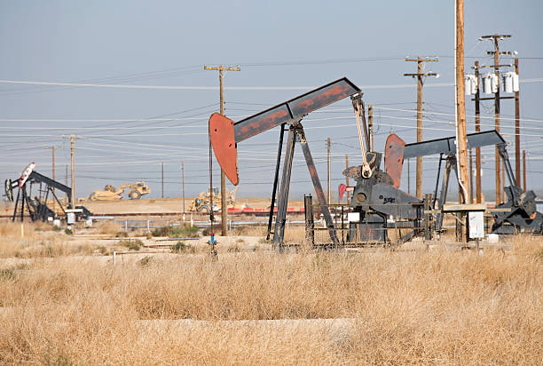 istock Pump jacks in oil field 183384257