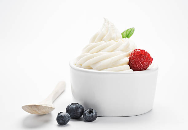 Soft Serve Frozen Yogurt - XXXL "SEVERAL MORE IN THIS SERIES. Bowl of frozen yogurt with fresh, healthy fruit and an eco-friendly bamboo spoon.  High resolution XXXL shot." frozen yoghurt stock pictures, royalty-free photos & images