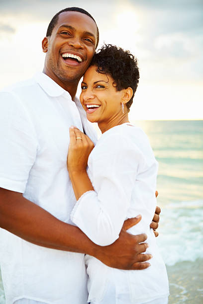 istock Romantic couple hugging on the beach 183384554