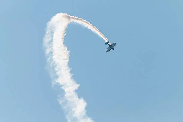 Air acrobat flying a loop up-side down in a sunny sky.similar images: