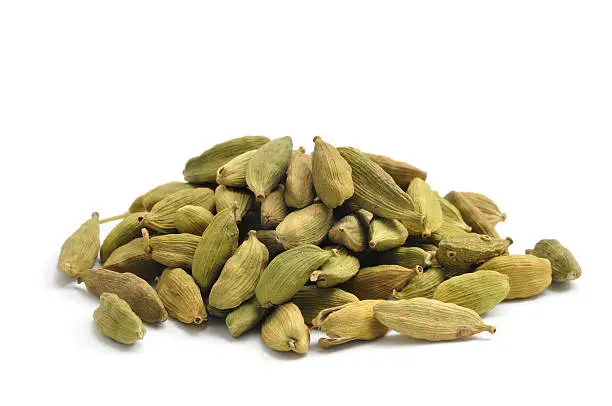 Green Cardamom pods isolated on a white background.