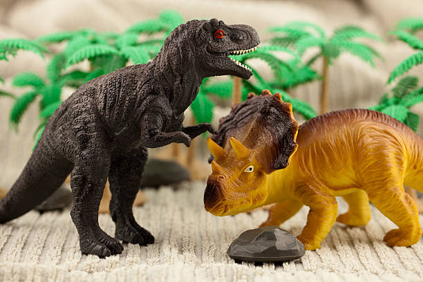 istock Dinosaurs in front of tropical canopy 183385027