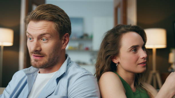 istock Closeup relaxed couple talking home weekend. Lazy love pair resting with gadgets 1833850996