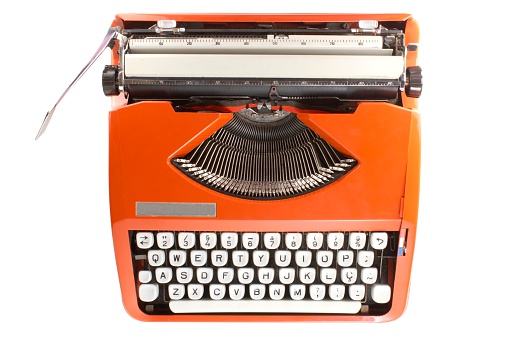 Old mechanical typewriter on a white background