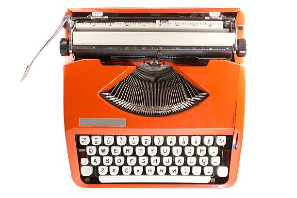 Orange retro typewriter with white keys stock photo