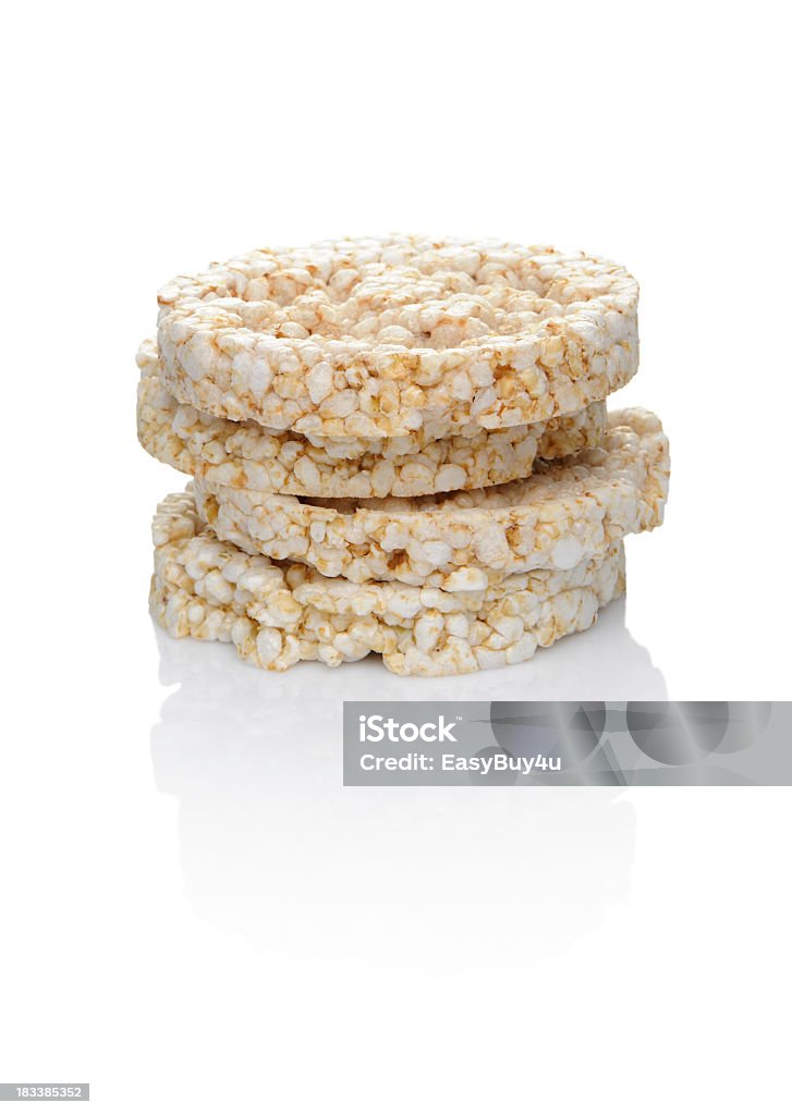 A closeup of stacked rice cakes on a white background Rice cakes snack isolated on white Rice Cake Stock Photo