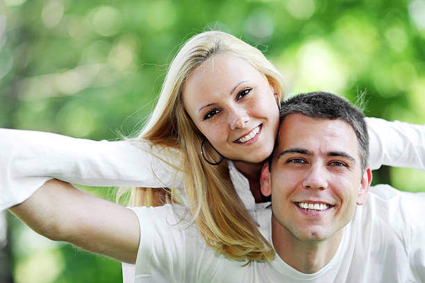 istock Lovely couple having fun in the green park. 183385361