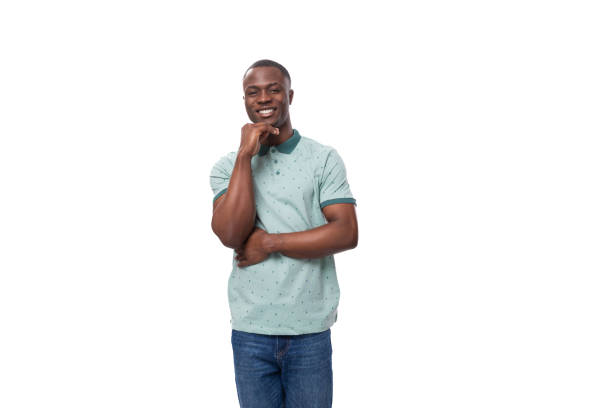 istock young charming american guy dressed in a mint t-shirt and jeans on a white background with copy space 1833853619