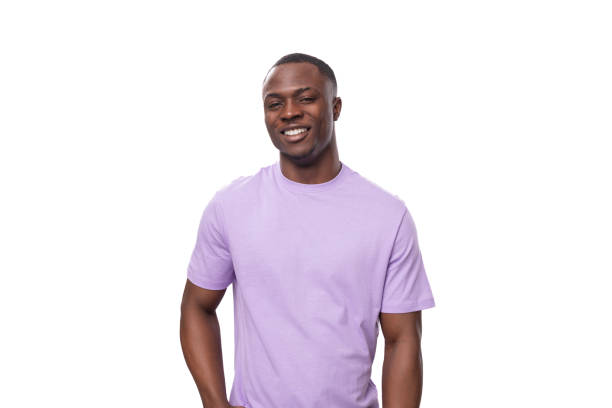istock young successful american man dressed in a light lilac t-shirt on a white background with copy space 1833853621