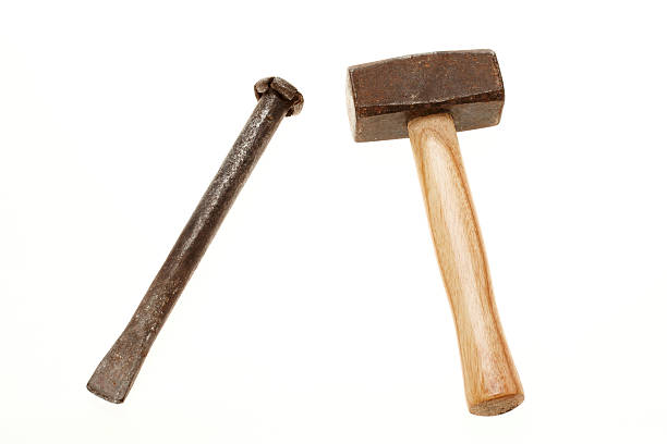 Hammer and chisel on white background stock photo