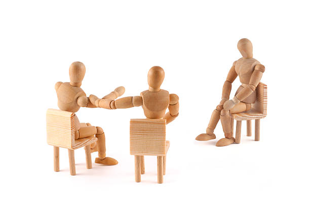 istock wooden mannequins in discussion 183387197