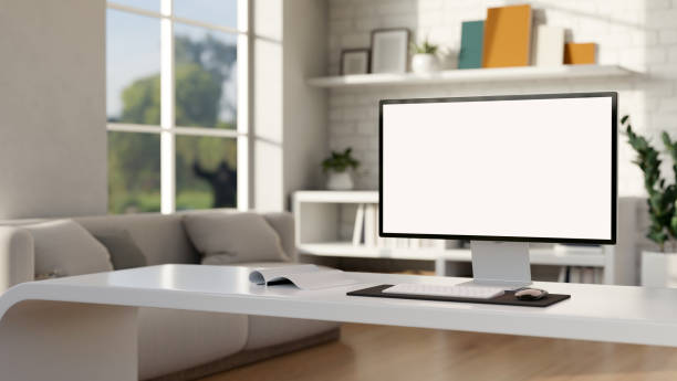 istock A computer with a white-screen mockup is on a white desk in a modern living room. Home workspace 1834015788