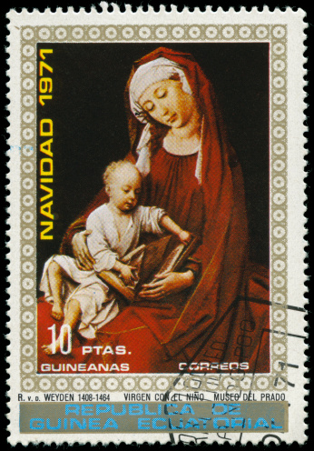 POLAND - CIRCA 1990:  A stamp printed in Poland shows a painting of the angel Gabriel telling Mary that she is going to have a baby, the Annunciation, circa 1990.  - see lightbox for more.
