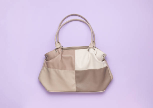 istock Stylish leather four-color women's bag on a blue background. 1834041963