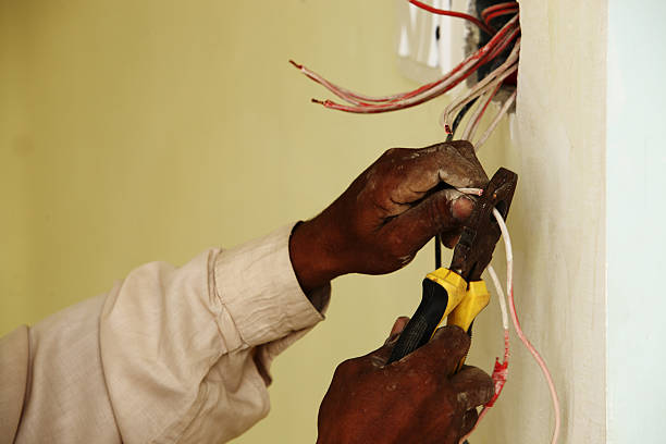 istock Electrician Fixing Electric Wires for Switches 183404933