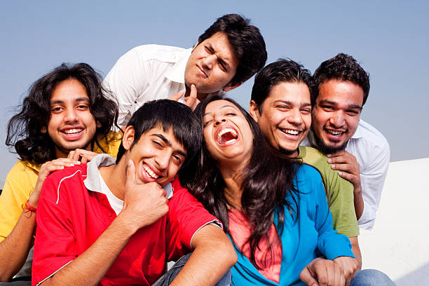 istock Six Cheerful Excited Indian Friends Having a Fun Time 183405102