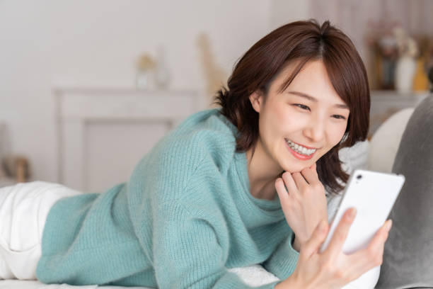 istock Asian woman using a smart phone 1834052332