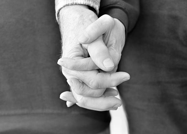 istock Senior Couple Holding Hands 183405473