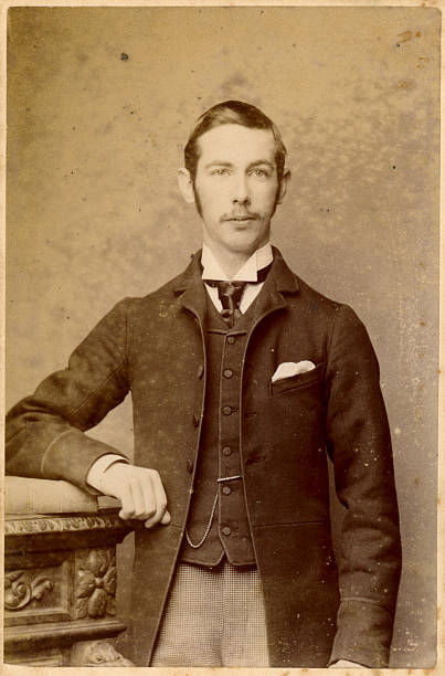 Young Victorian Man Old Photograph "Vintage photograph of a man from the victorian era, circa 1870" 19th century photos stock pictures, royalty-free photos & images