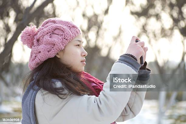 Girl In The Snow Field Stock Photo - Download Image Now - Outdoors, Photographing, Tree