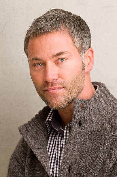 istock A Man With Short Hair and a Sweater Looking into the Camera 183407424