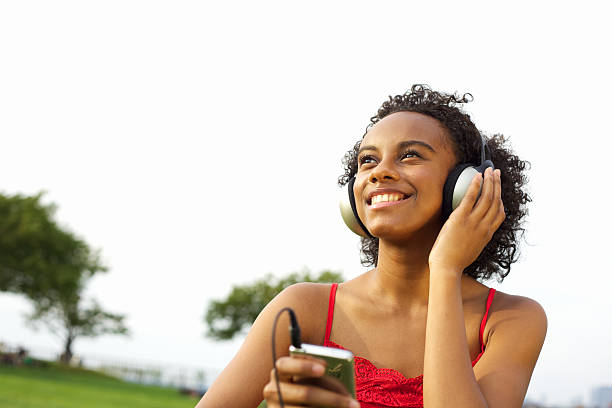 istock Woman Listening To MP3 Player 183407500